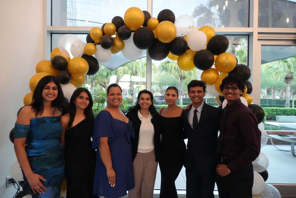 Stuti and fellow attendees gathered for a group photograph at a banquet
