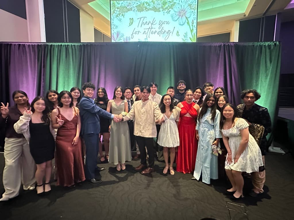 SASE team members gathered for a group photograph in formal attire